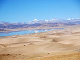 35 Sand Dunes Morning Between Old Zhongba And Paryang Tibet The mountains are reflected in the water next to the sand dunes in the morning sun on the road between Old Zhongba and Paryang Tibet.